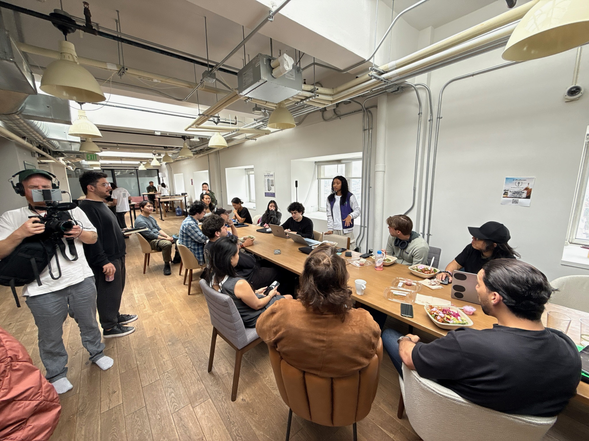 Community event with founders gathering around table