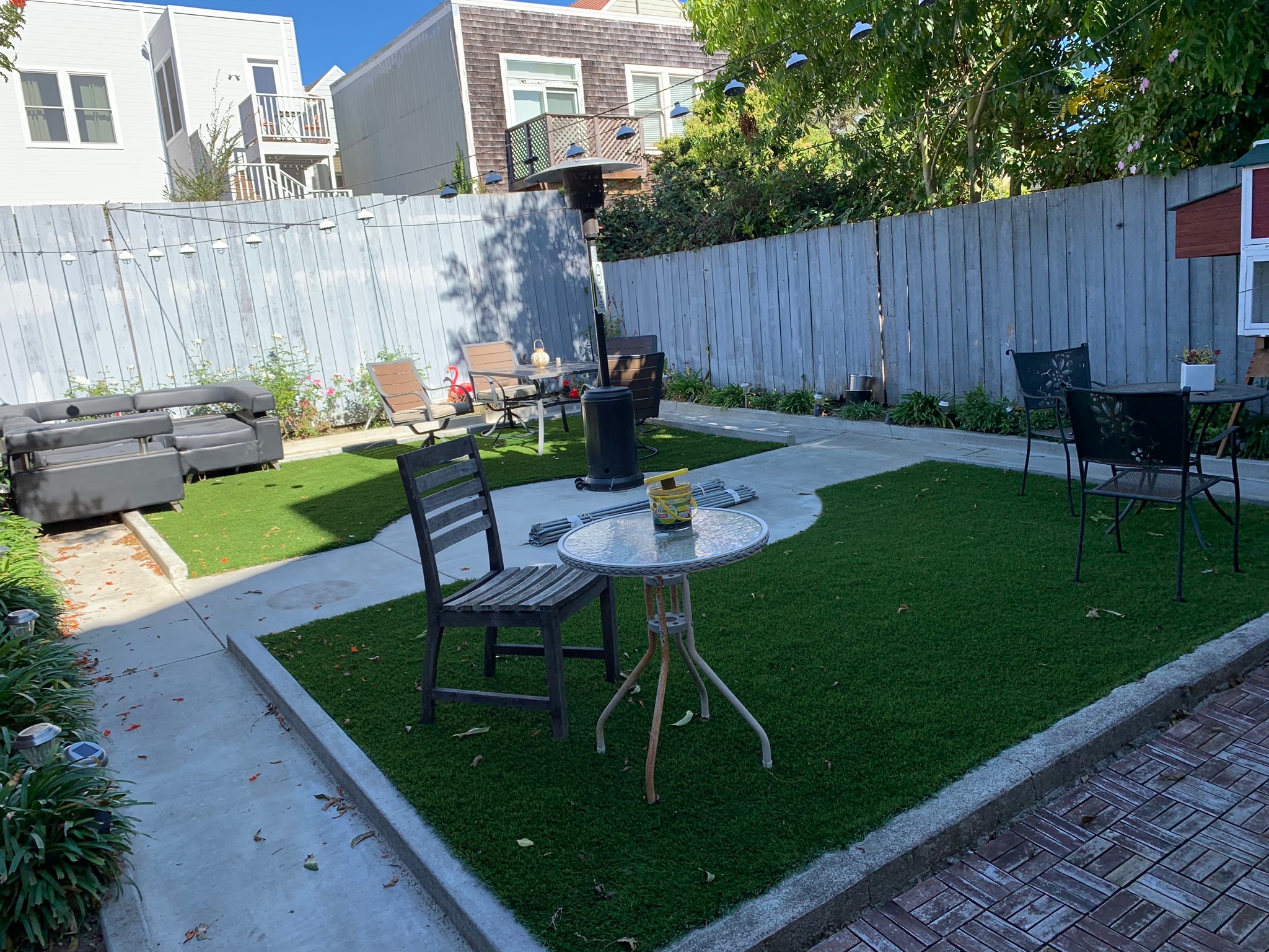 Backyard patio with BBQ grill and outdoor dining area